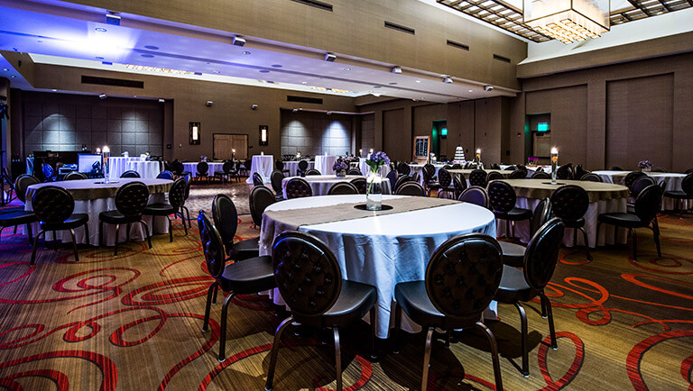 tables and chairs set up for an event in the coosawada room