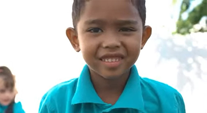 Video still of a young kid